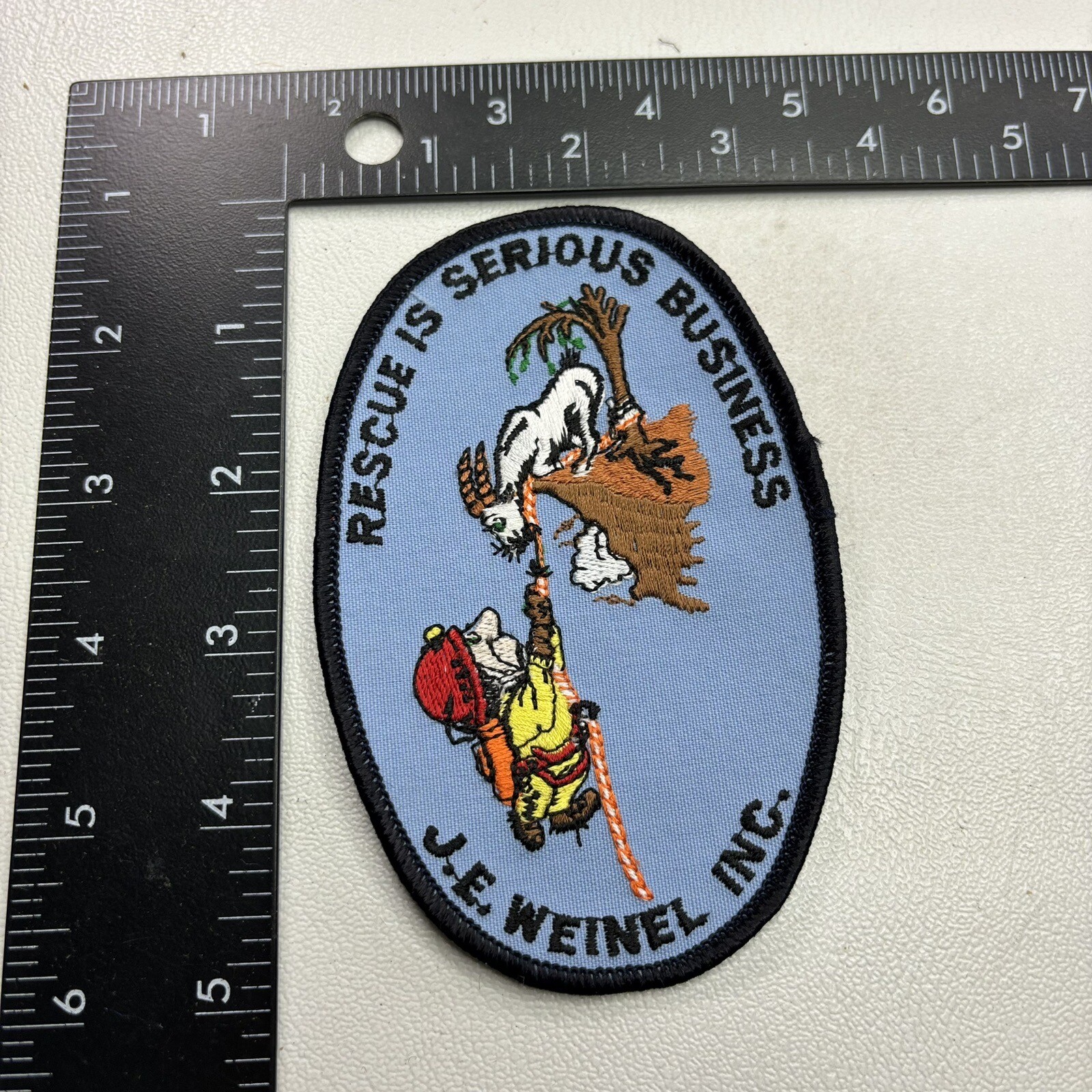 RESCUE IS SERIOUS BUSINESS J.E. WEINEL INC. Patch (Fireman & Goat) 38TS