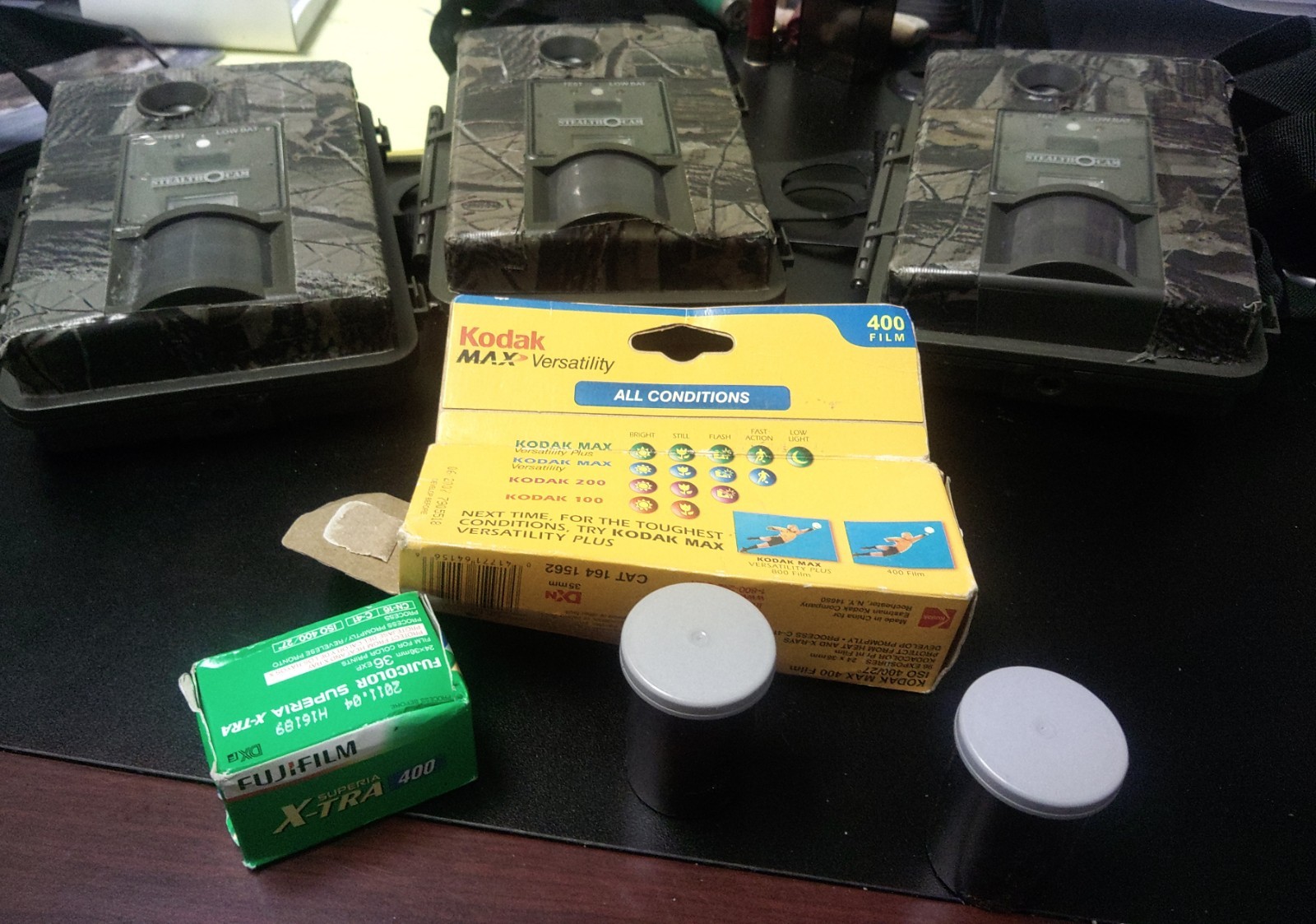 Three (3) Stealth Cams & 3 rolls Kodak  400 & FujiFilm400 35mm Film. As Lot.