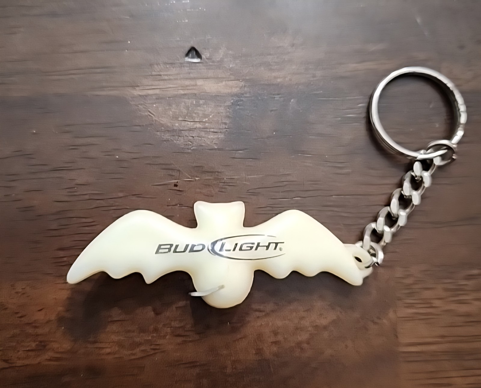 Vintage Bud Light bat-shaped bottle opener keychain. Glows In The Dark