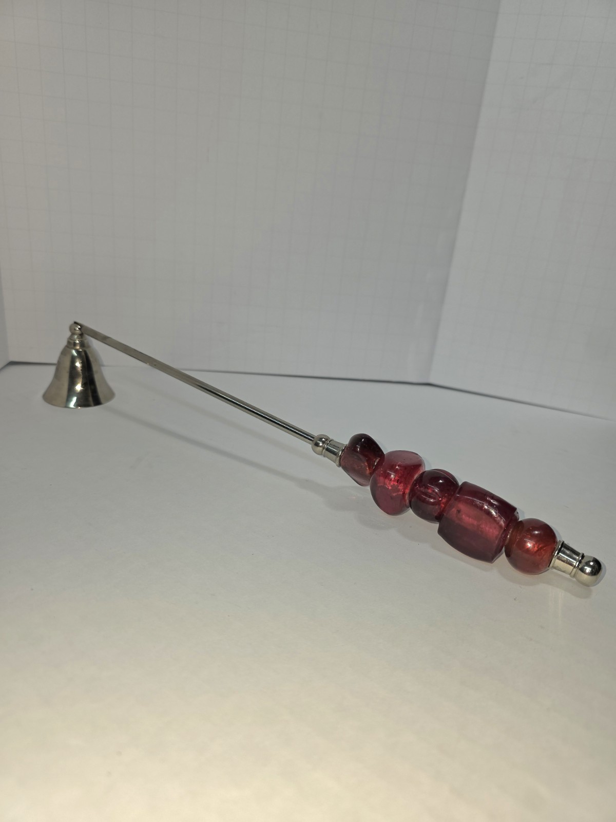 Vintage 13” Candle Snuffer With Red blown Glass Beaded handle.