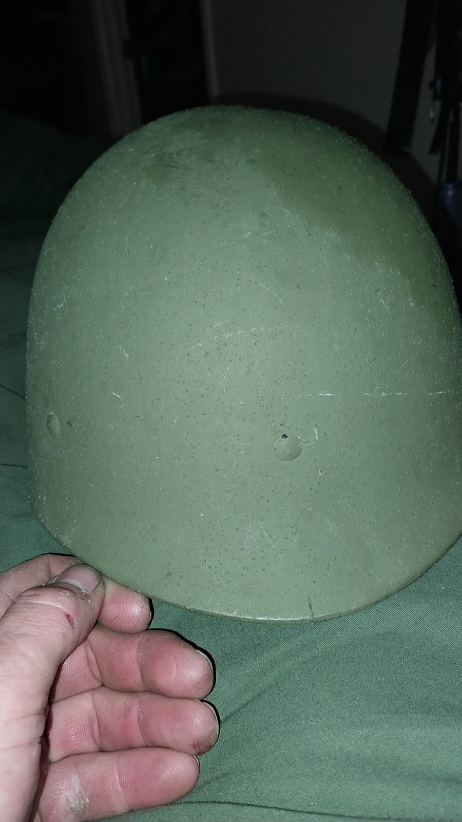 The image shows the liner and suspension system of a U.S. Army M1 helmet.