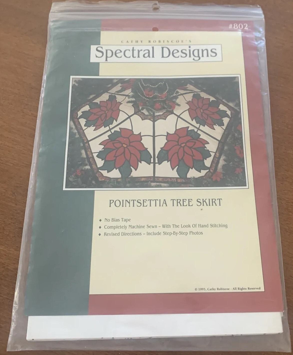 Cathy Robiscoe’s Spectral Designs Pointsettia Tree Skirt
