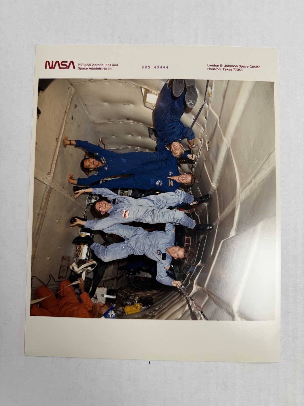 NASA STS-61C Crew Performs Zero Gravity Acrobatics Press Photo