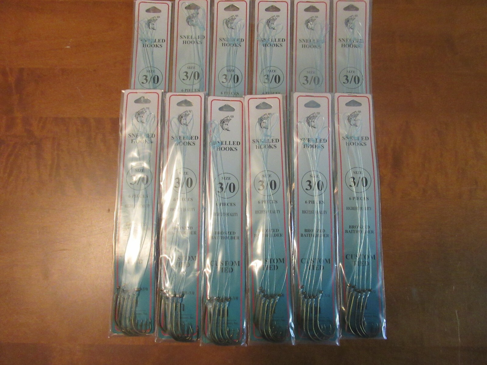 72 SNELLED FISH HOOKS (12 PKS X 6 EA)  BRONZE BAIT HOLDER MONO LEADER 7" PICK SZ
