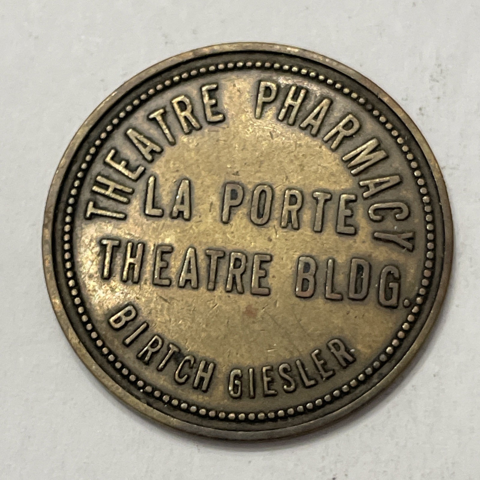 La Porte Indiana Trade Token Theatre Pharmacy Birtch Giesler $1.00 Merchandise