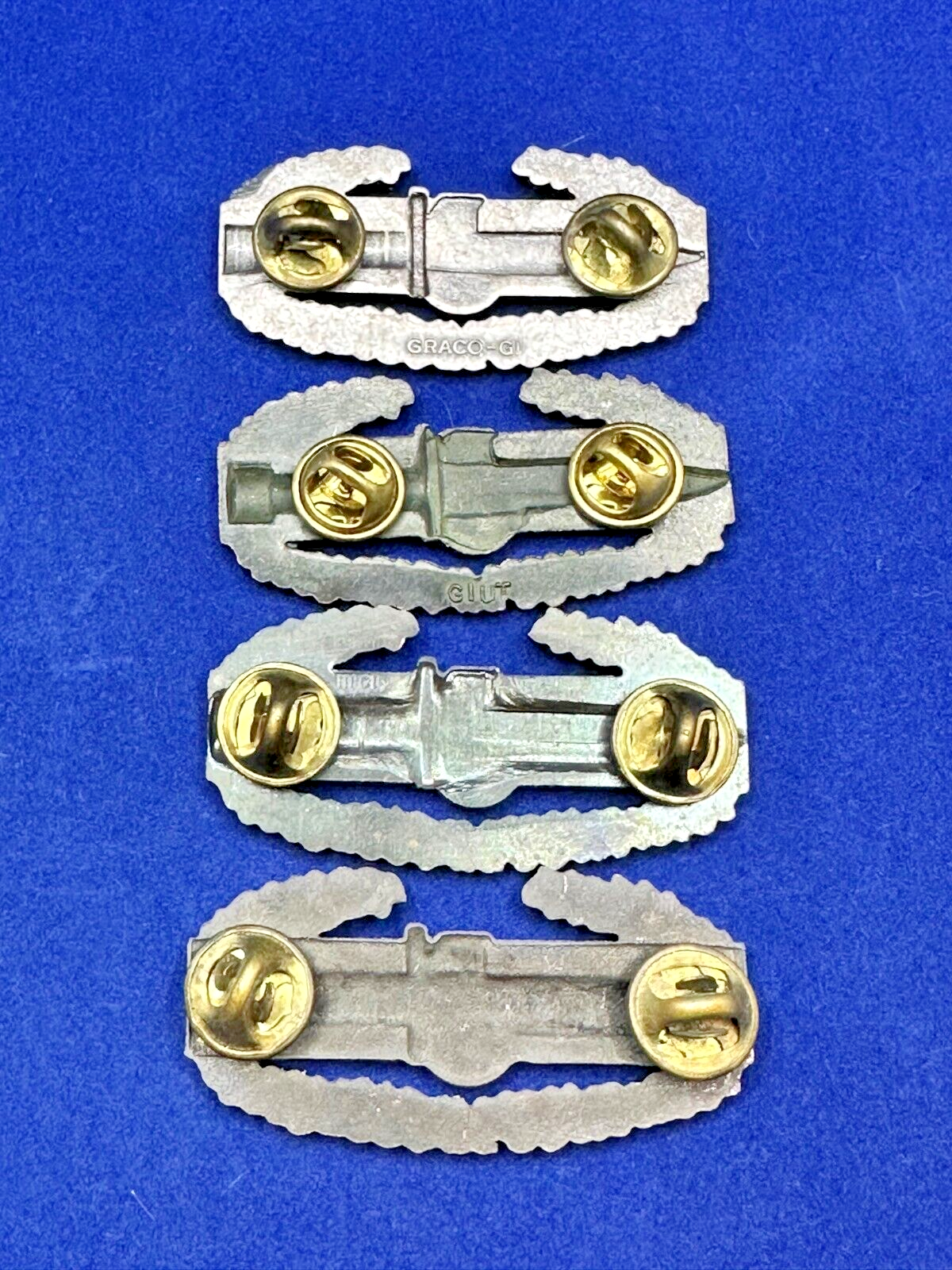 US Modern Combat Action Badge Military Pin Subdued (Various Marks)