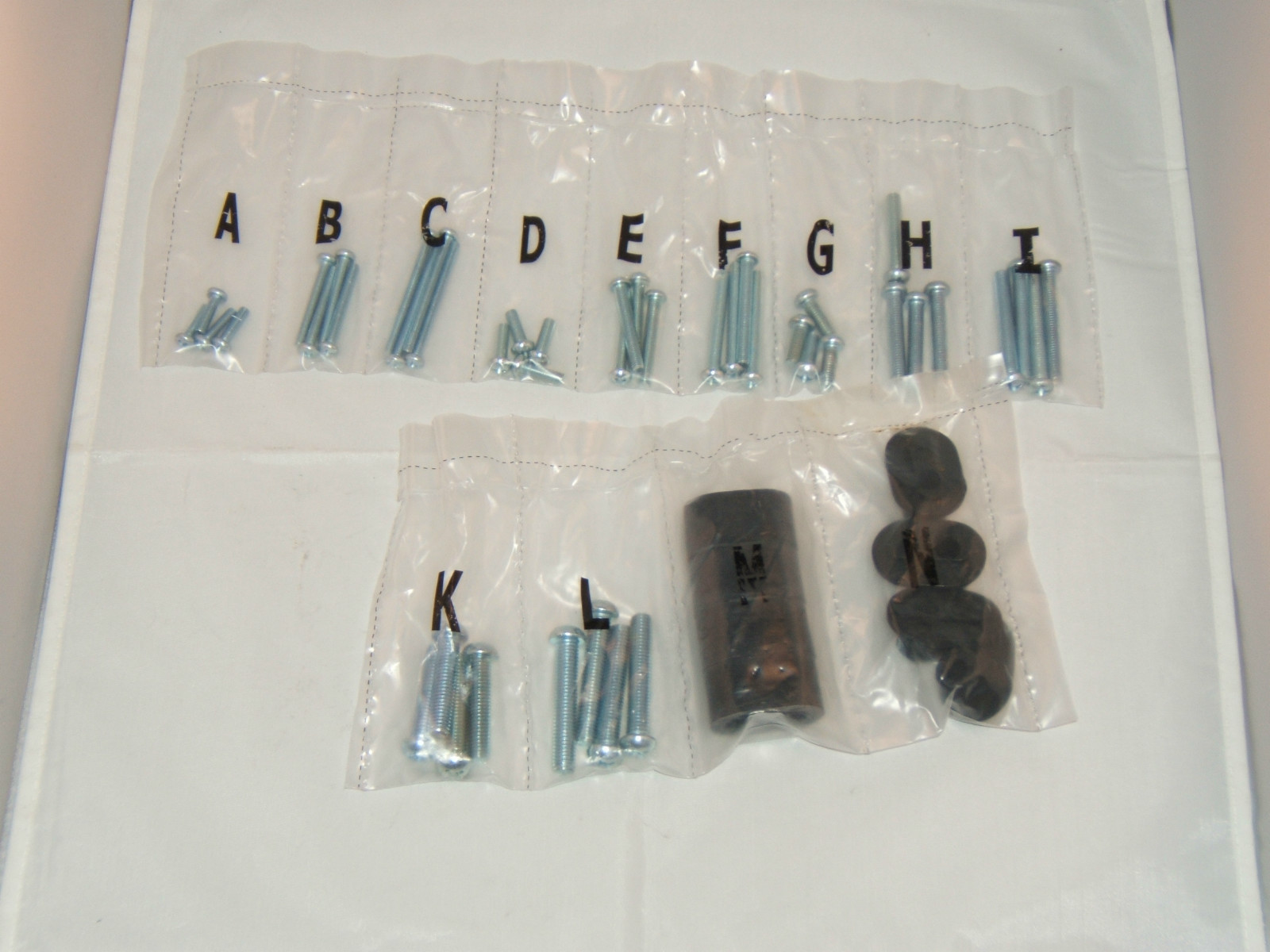 ASSORTED BOLTS AND RUBBER SPACERS "NEW"