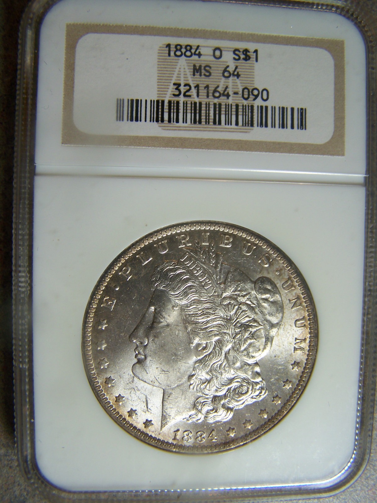 1884 O Morgan Silver Dollar ~ NGC MS64 ~ White Beauty w/ Toning