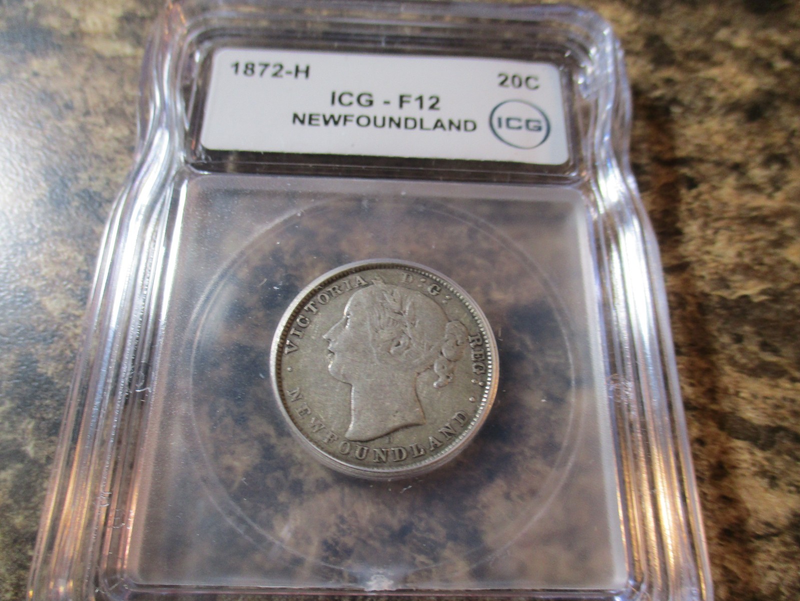 1872-H NEWFOUNDLAND 20 CENTS ICG F12      402