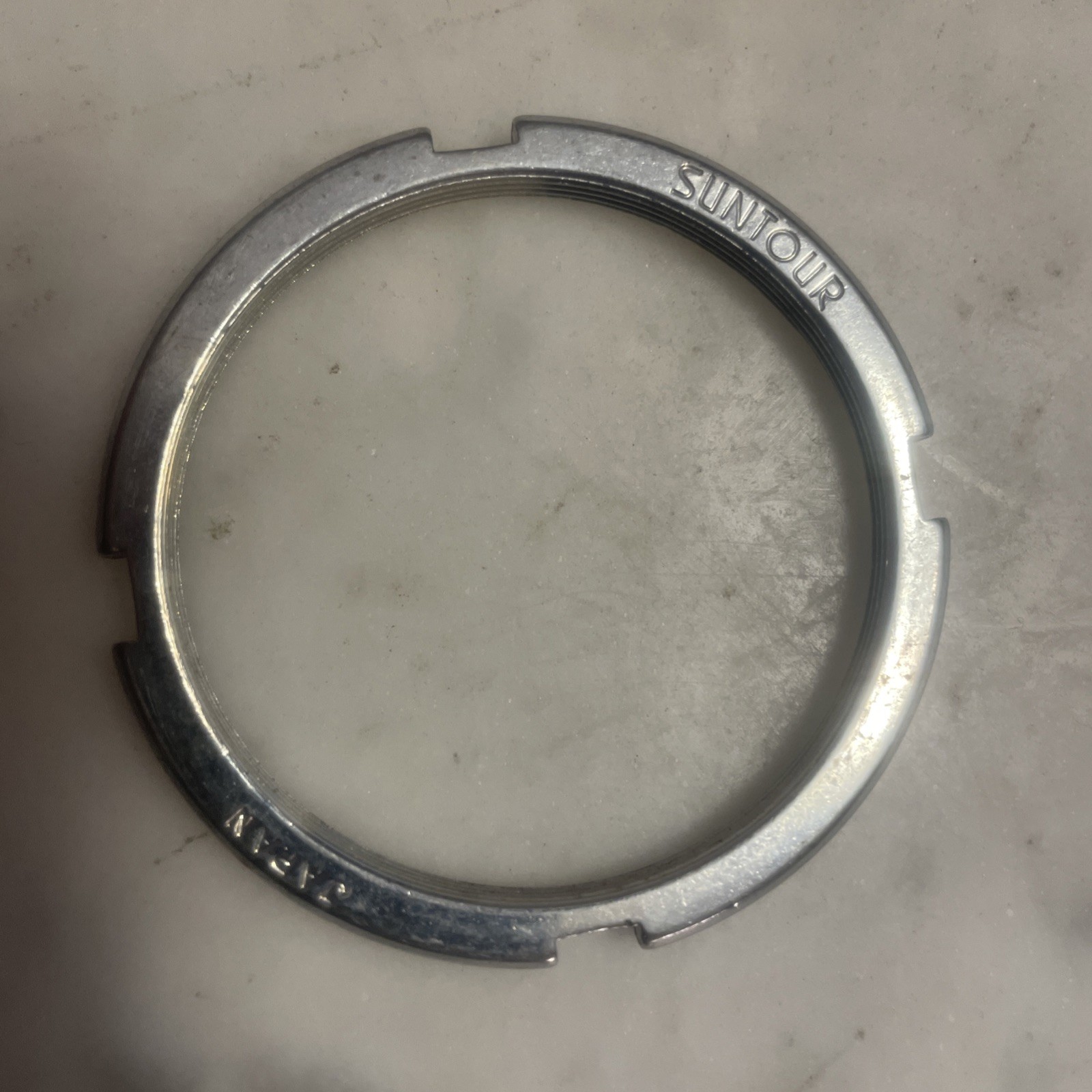 Vintage New-Old-Stock SUNTOUR 50mm Bottom Bracket Lockring.    (NJ)