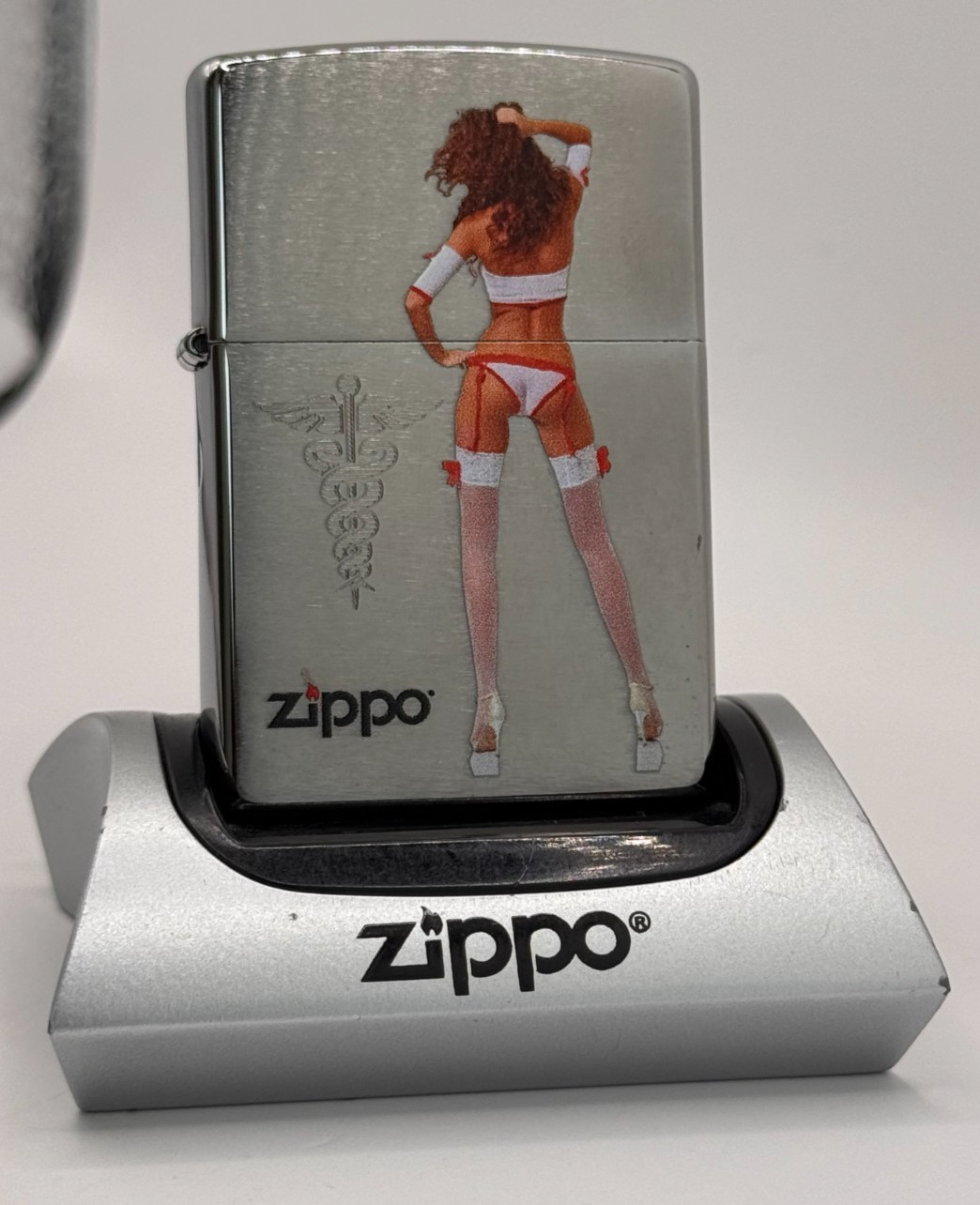 GENUINE Zippo Lighter NAUGHTY NURSE CADUCEUS PIN UP Brushed Chrome NEW IN BOX