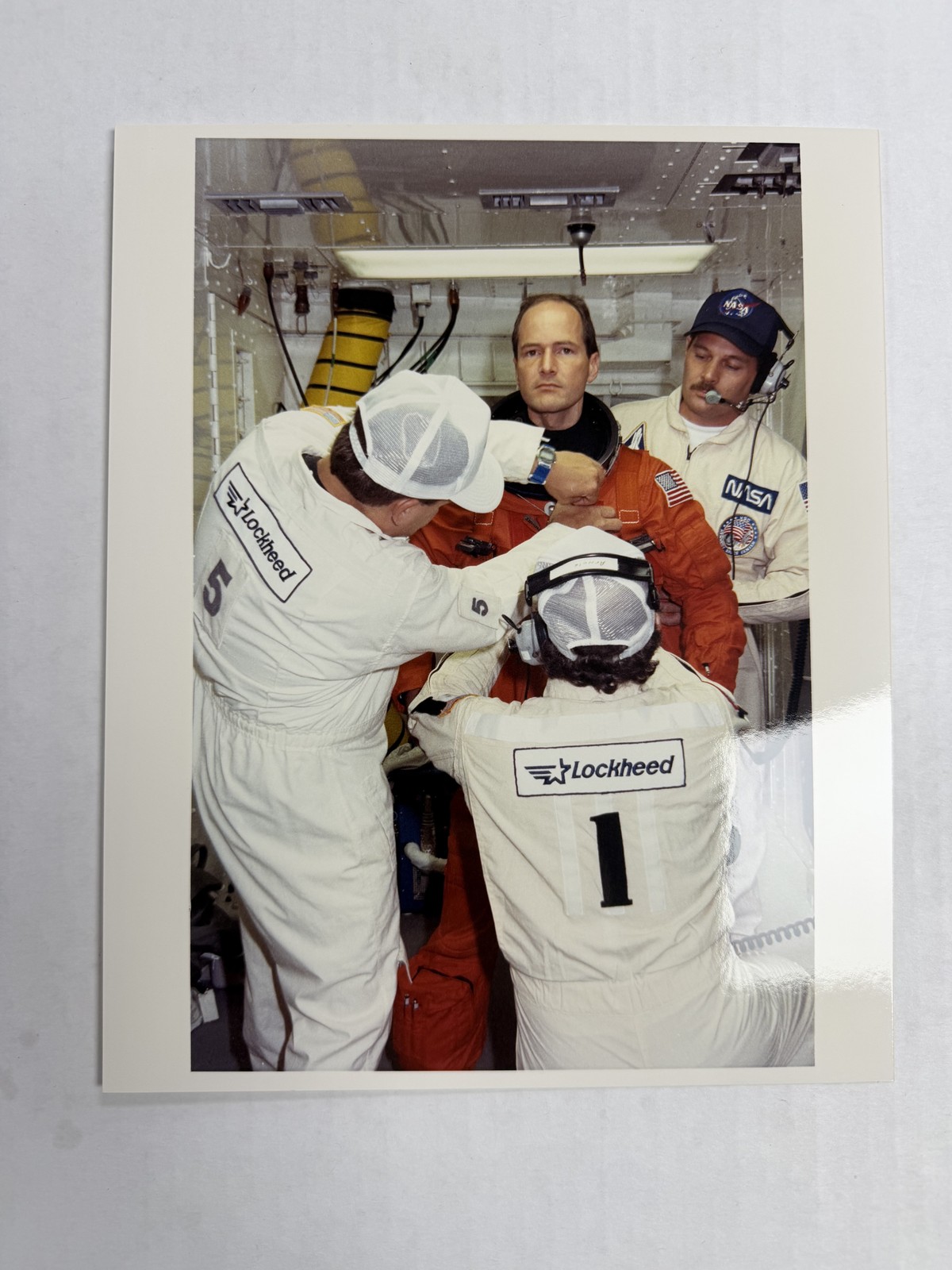 NASA STS-43 David Low Assisted During Suitup Press Photo