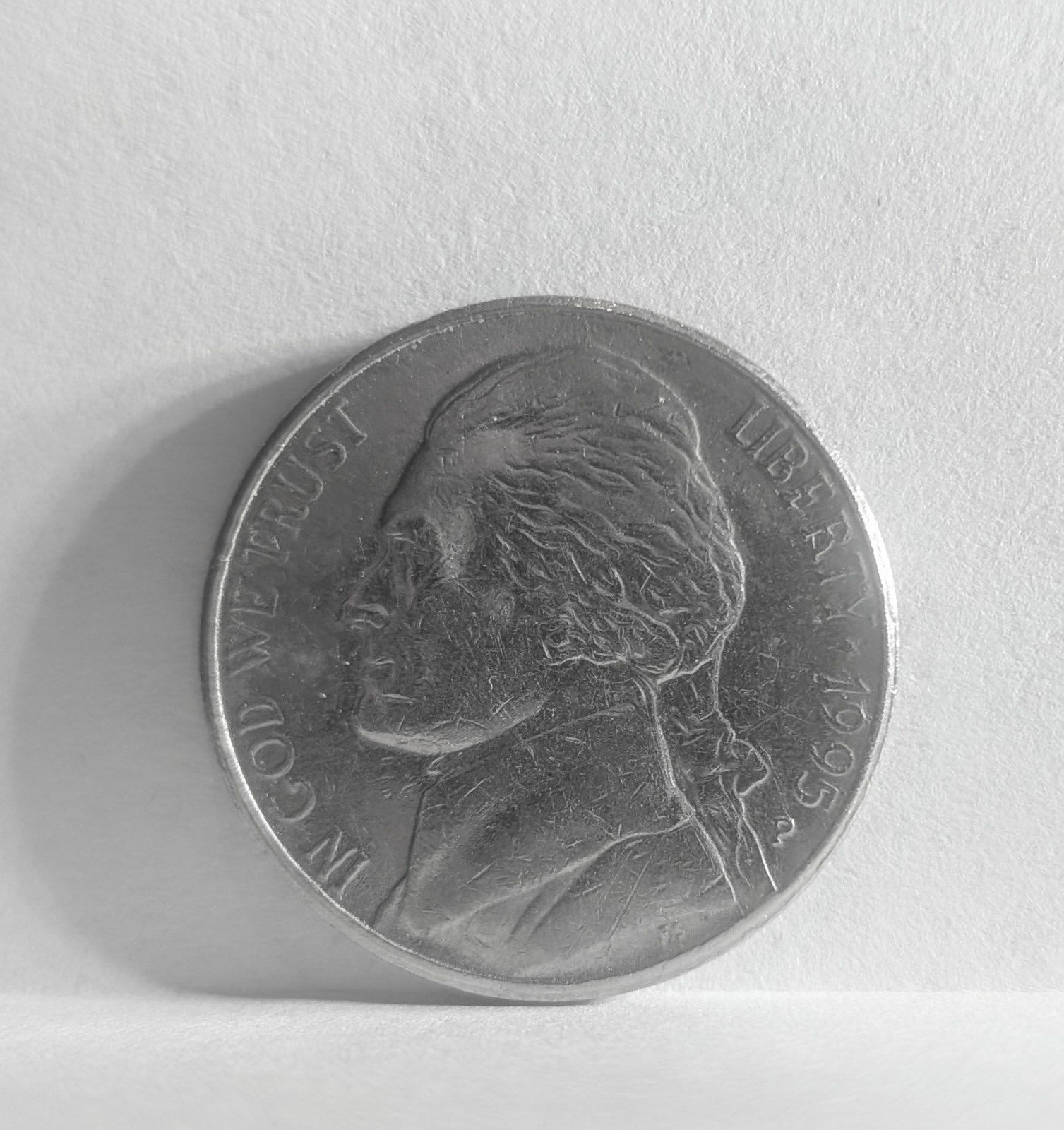 1995 P Nickel.  Dual Sided Partial Collar Strike