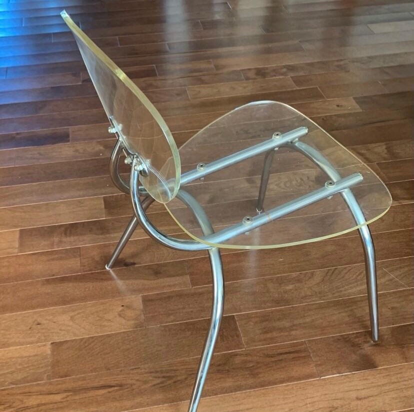 Contemporary acrylic and steel chair. Artsy!