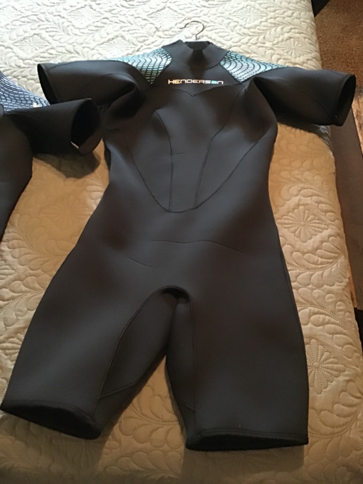 mens and womans Henderson Green Prene wetsuits. mens large womens 10