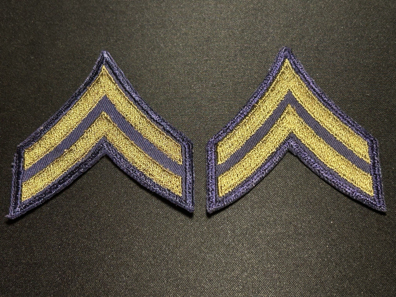 WWII US Army Corporal Chevron Rank Pair OD On Blue