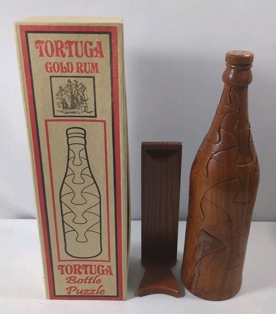 VINTAGE TORTUGA GOLD RUM WOODEN BOTTLE PUZZLE WITH STAND