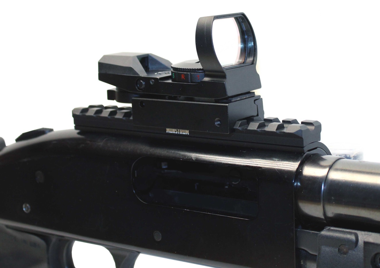 Mossberg 500 12 gauge pump picatinny rail shell carrier and reflex sight combo.