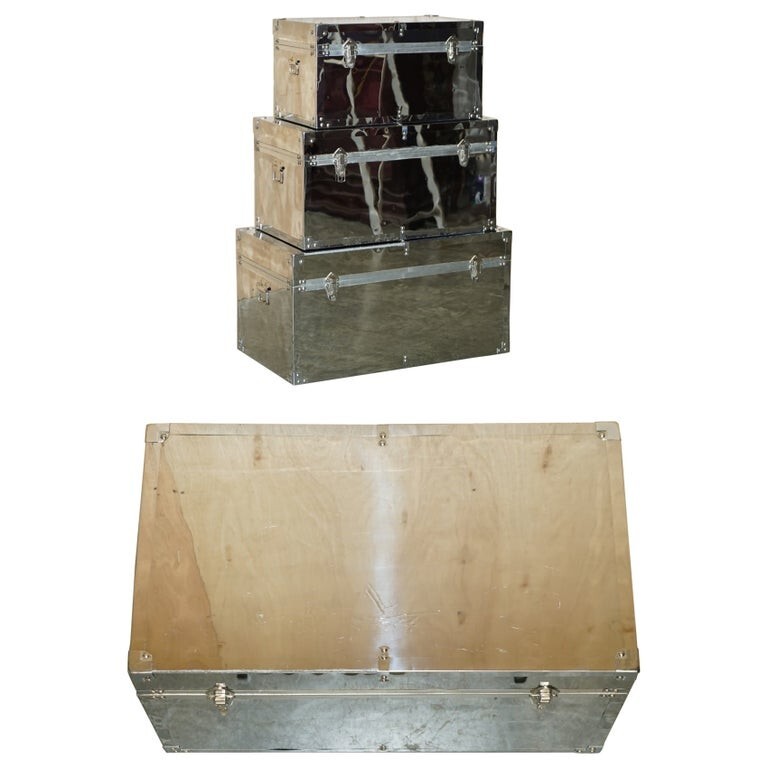 DECORATIVE SUITE OF THREE PROGRESSIVE SIZED CHROME & STEEL STORAGE TRUNK CHESTS