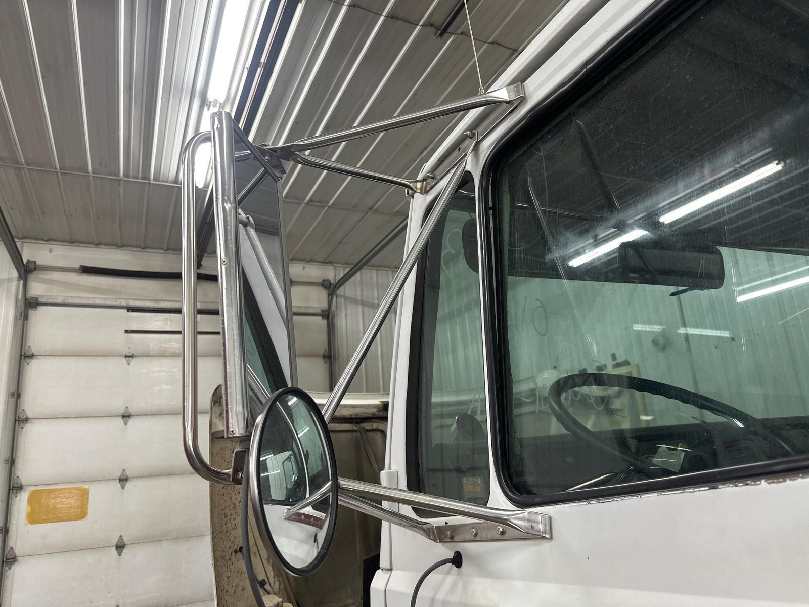 1991-2004 Freightliner FL70 STAINLESS Left/Driver Door Mirror - Used