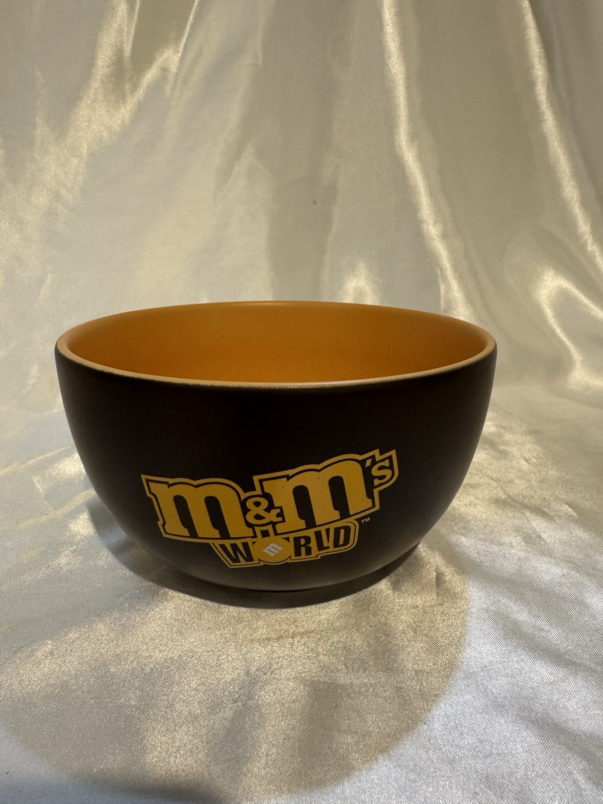 M & M  World Brown Orange Inside bowl from Mars M&M world. 2005. 6”W 3” T