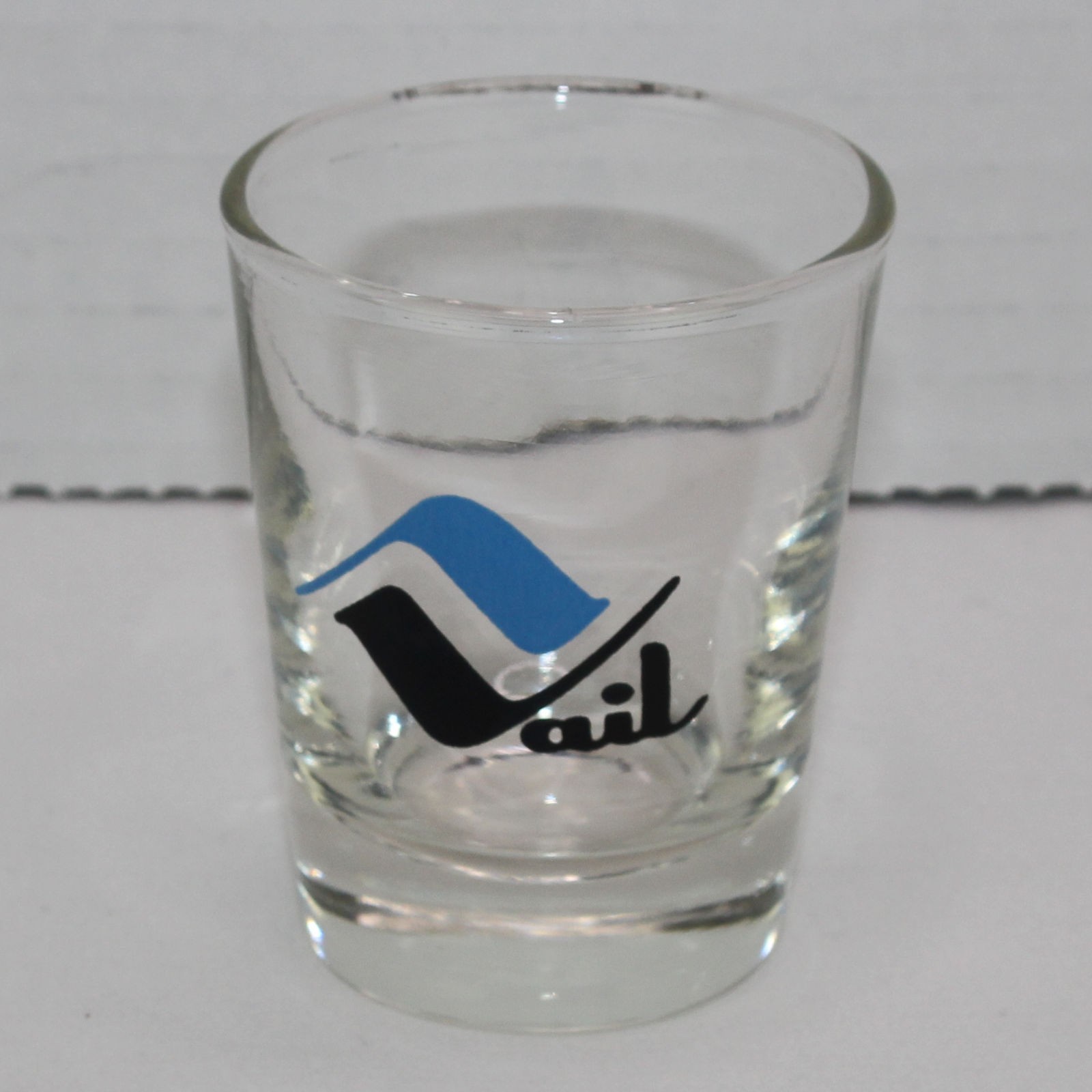 Vail Shot Glass 2.375 Inches Tall Black and Blue Logo