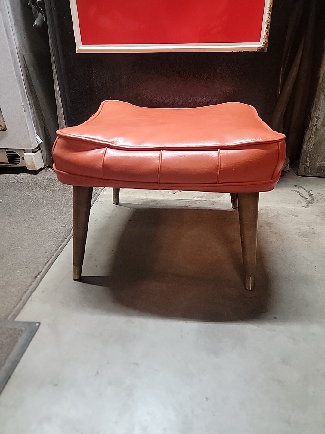 Vintage Mid Century Orange Vinyl Foot Stool Ottoman w/ Tapered Wood & Brass Legs
