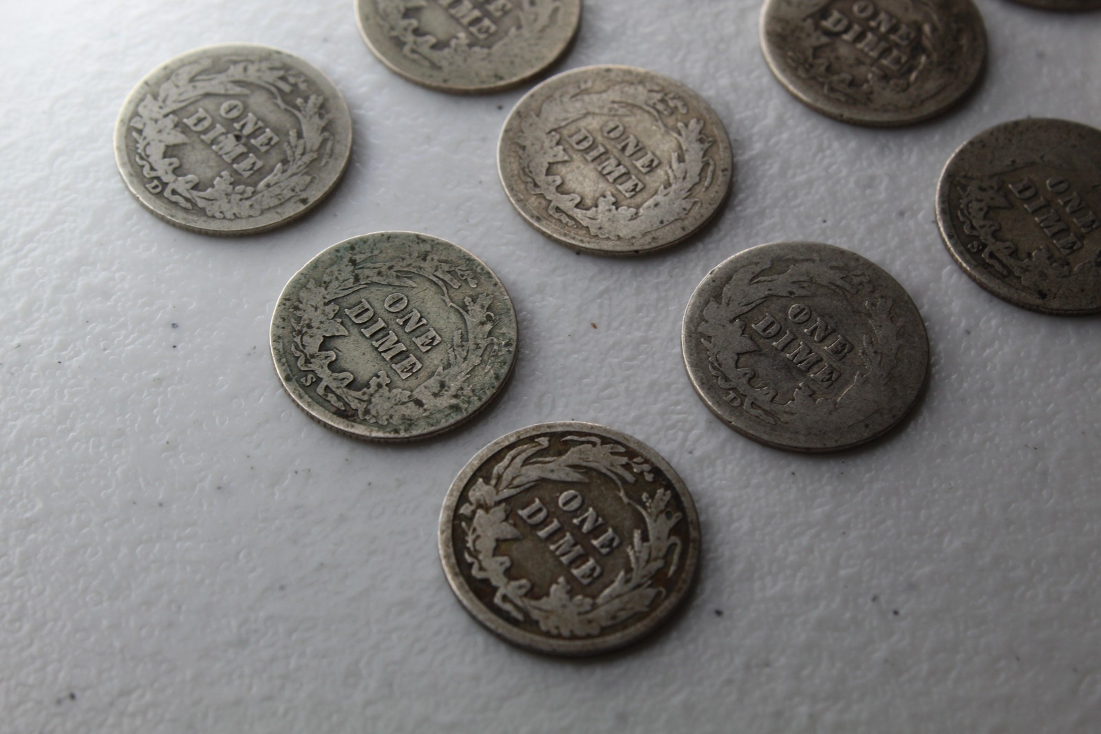 12 Very Old Very Worn Barber Dimes with dates