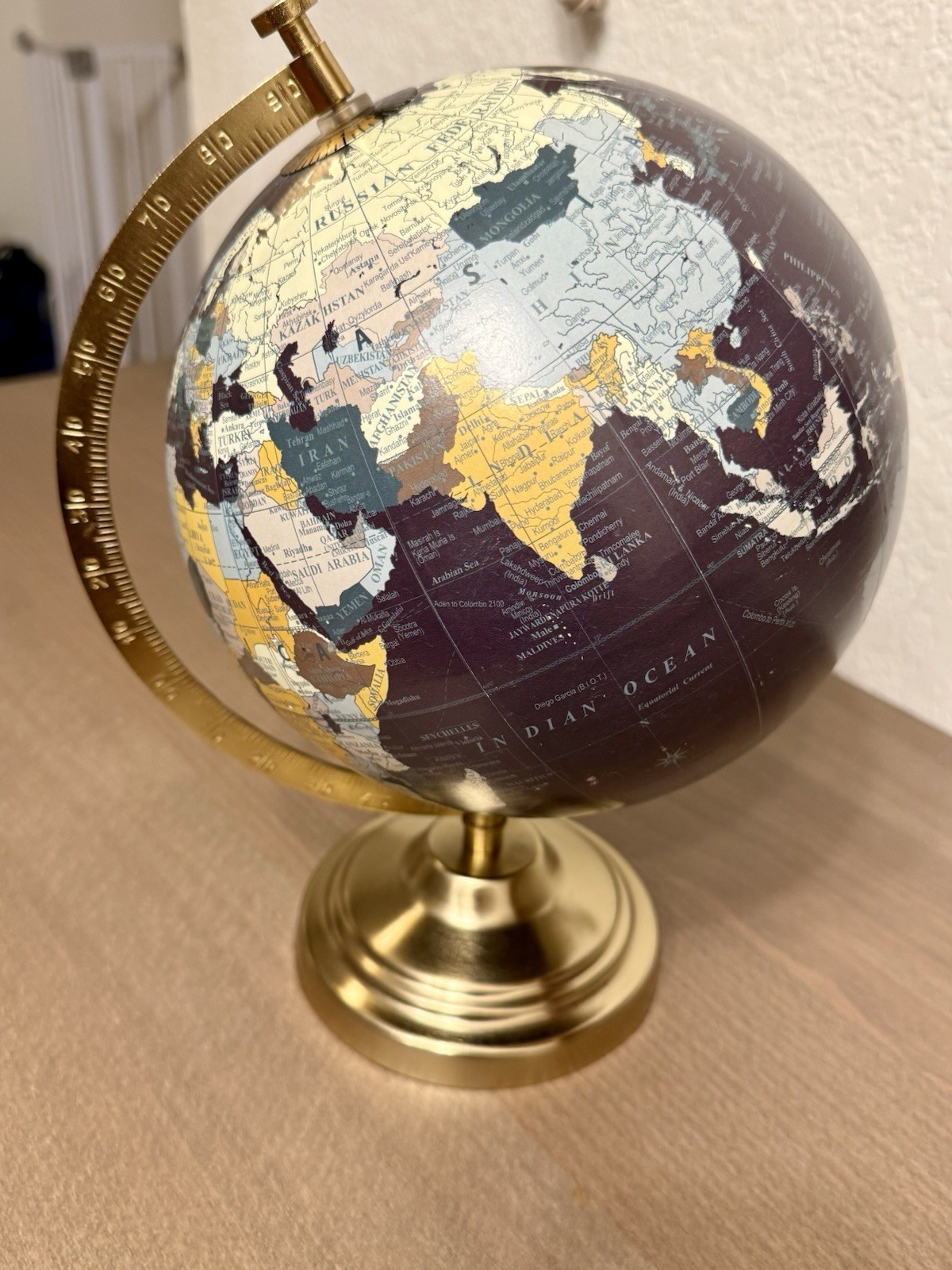 Designco Decorative Tabletop Globe Rotating World Globe Brass Tone Base