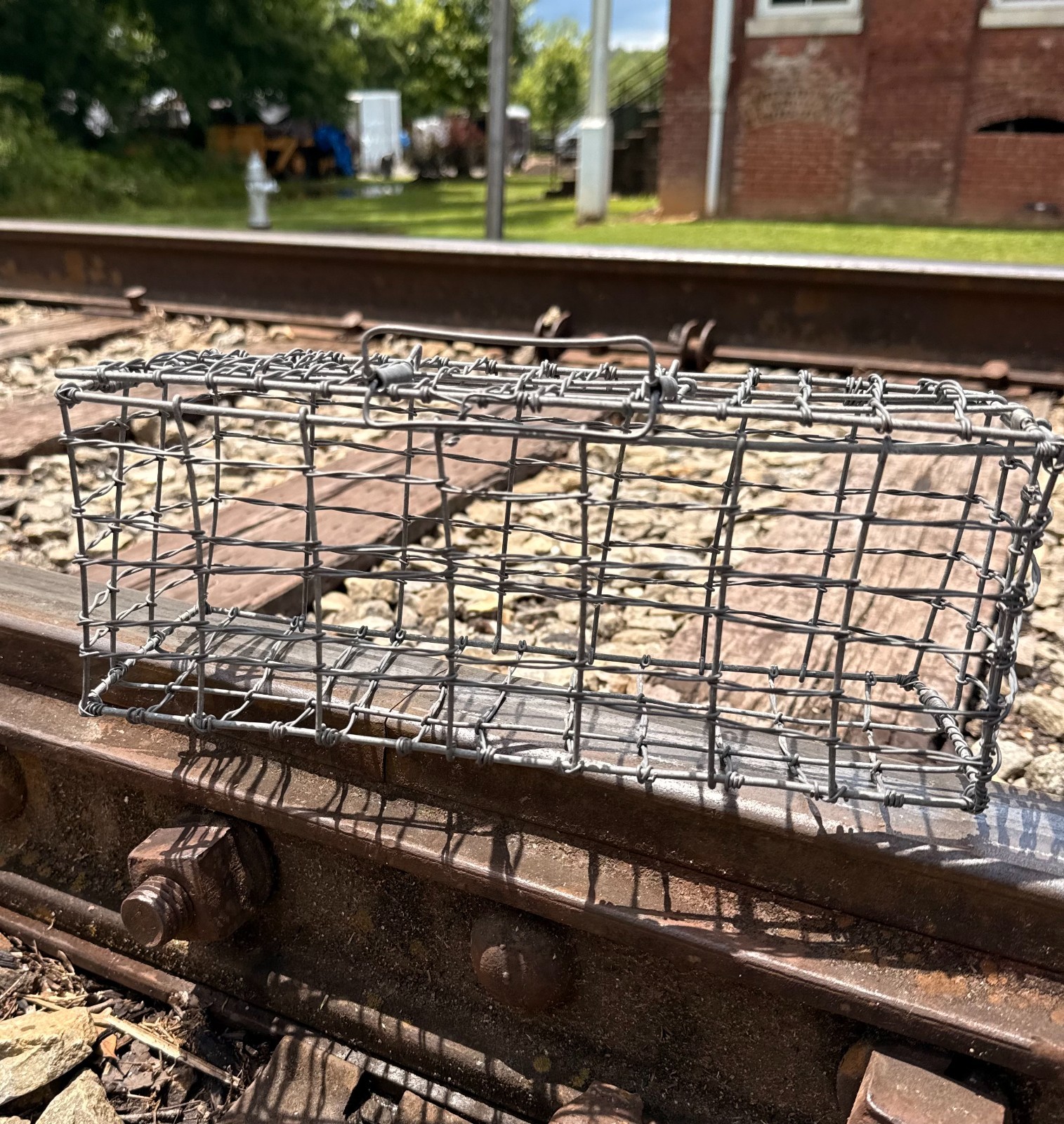 small rectangular wire baskerbasket with attached lid and clasp graden or home