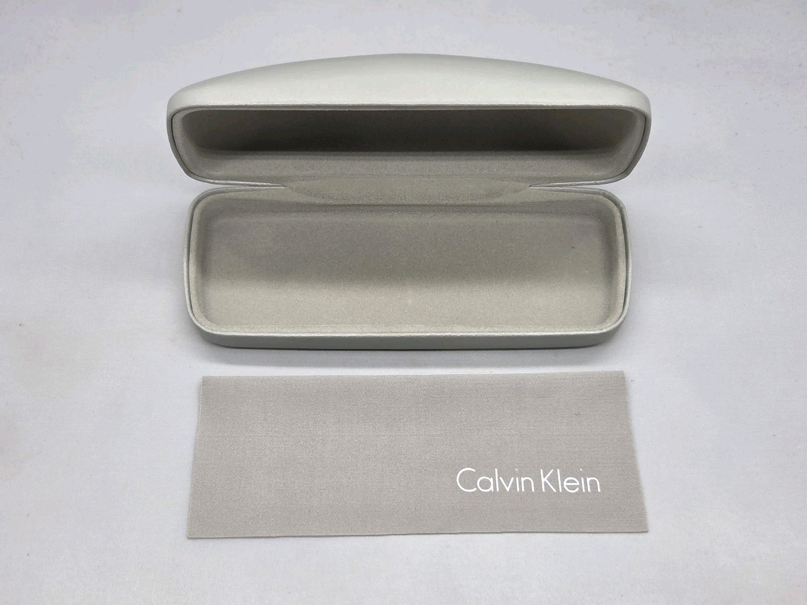Calvin Klein Light Gray Clamshell Eyeglass Case