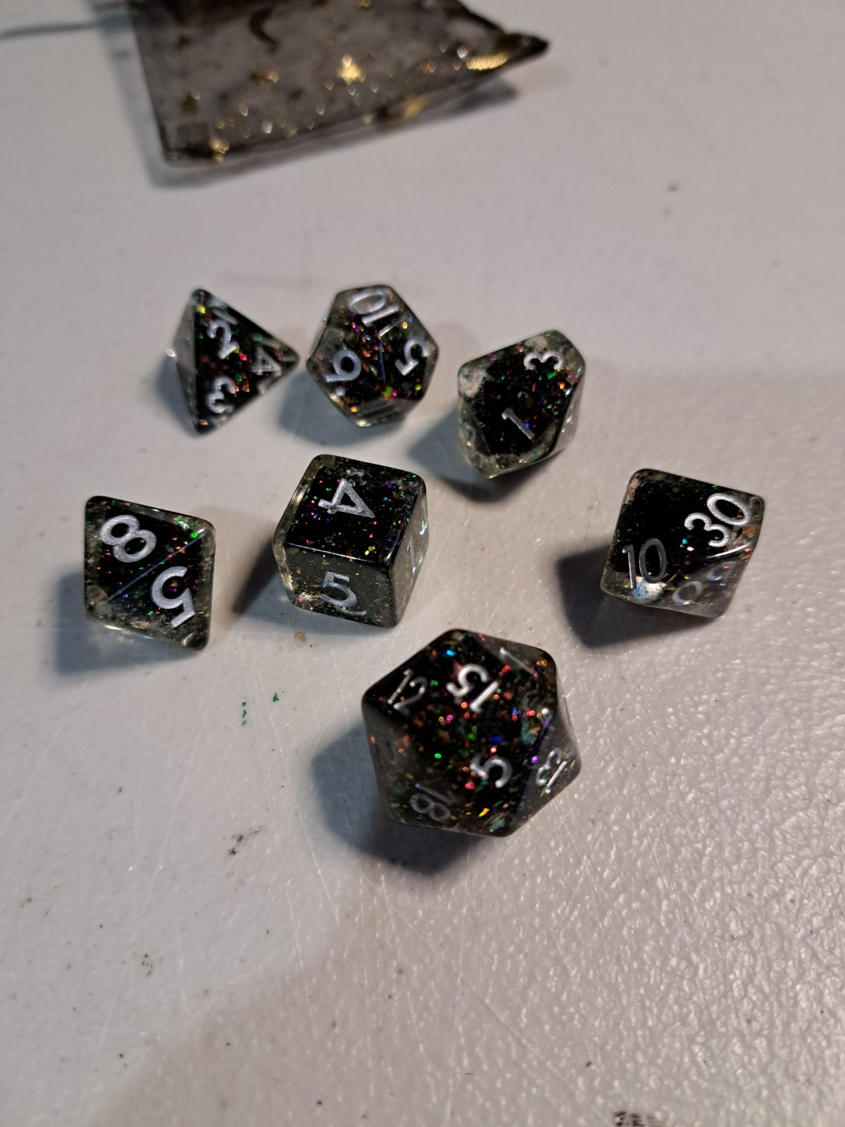 7 Peice Acrylic Dice. Clear & Glitering Black with Whit Numbers