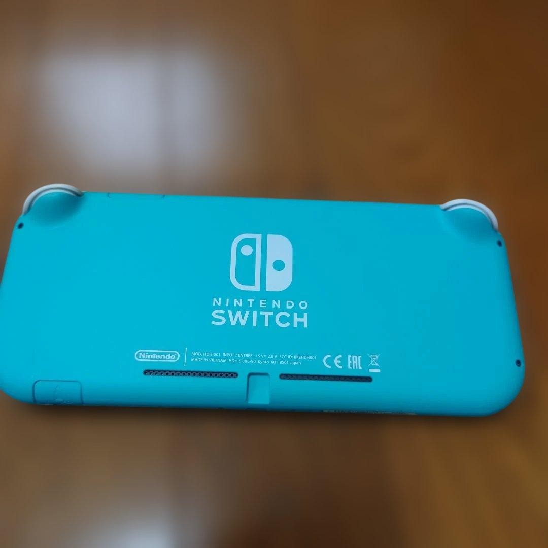 Excellent condition Nintendo Switch Lite Turquoise with Charger and Box