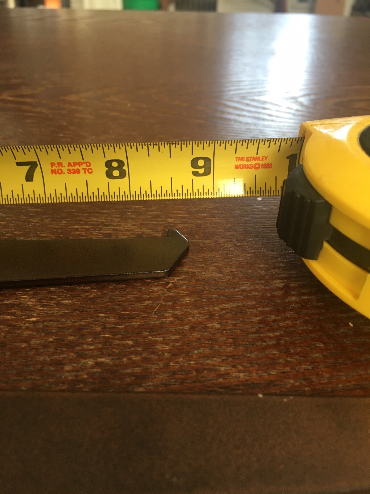 2 brown metal shelf support arms 8" after Slotted.