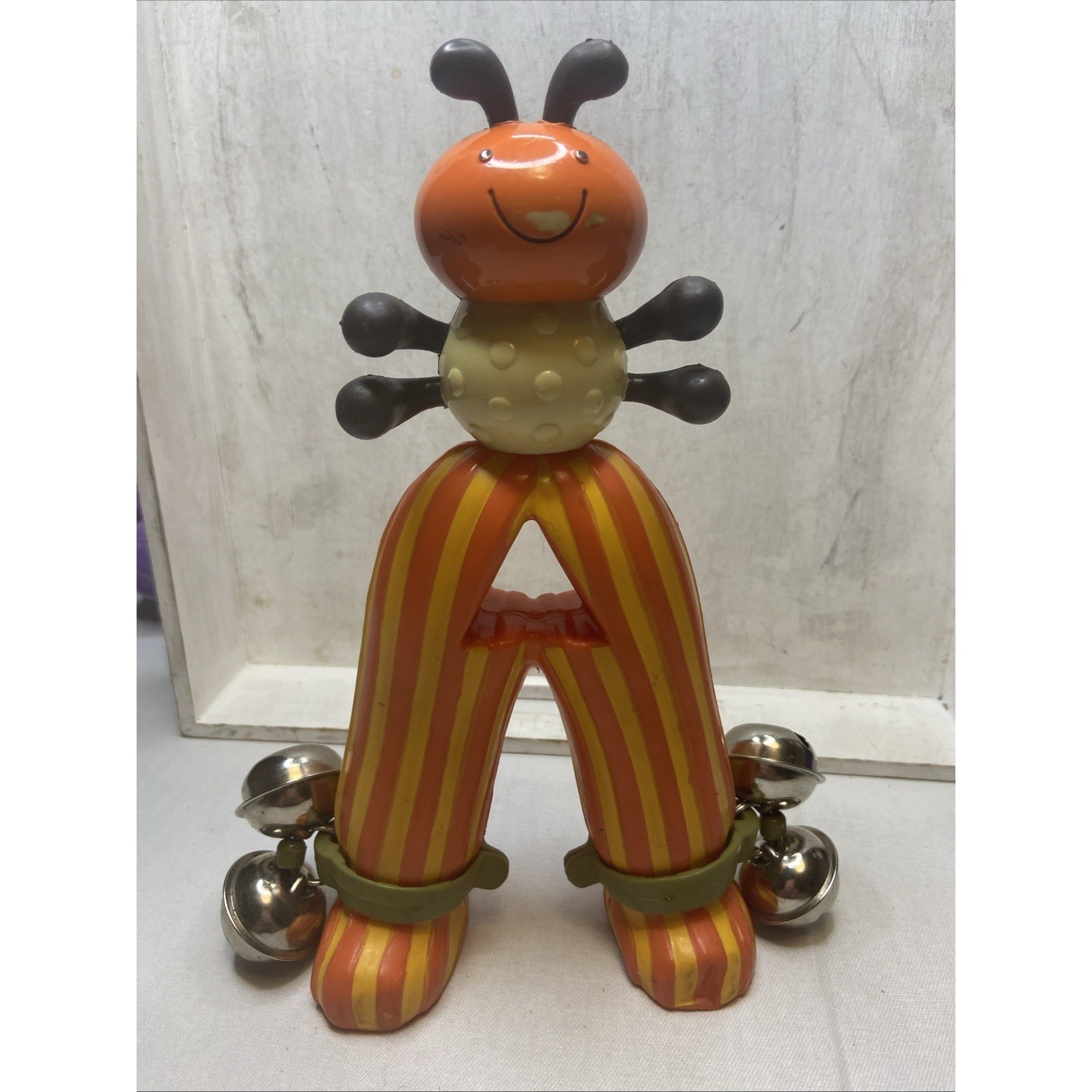 B. Toys Bug Jingle Bell Shaker Musical Instrument Orange Yellow Striped Toy
