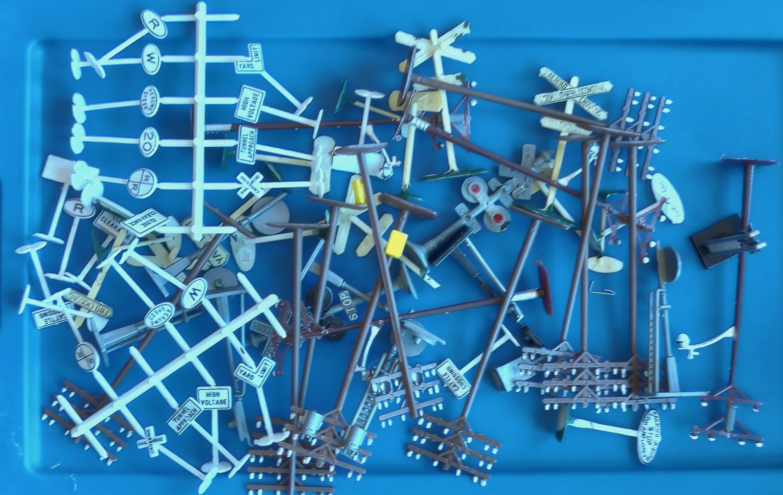 60 Plus Pieces Grab bag, Signs, Poles, Crossings etc... HO Scale