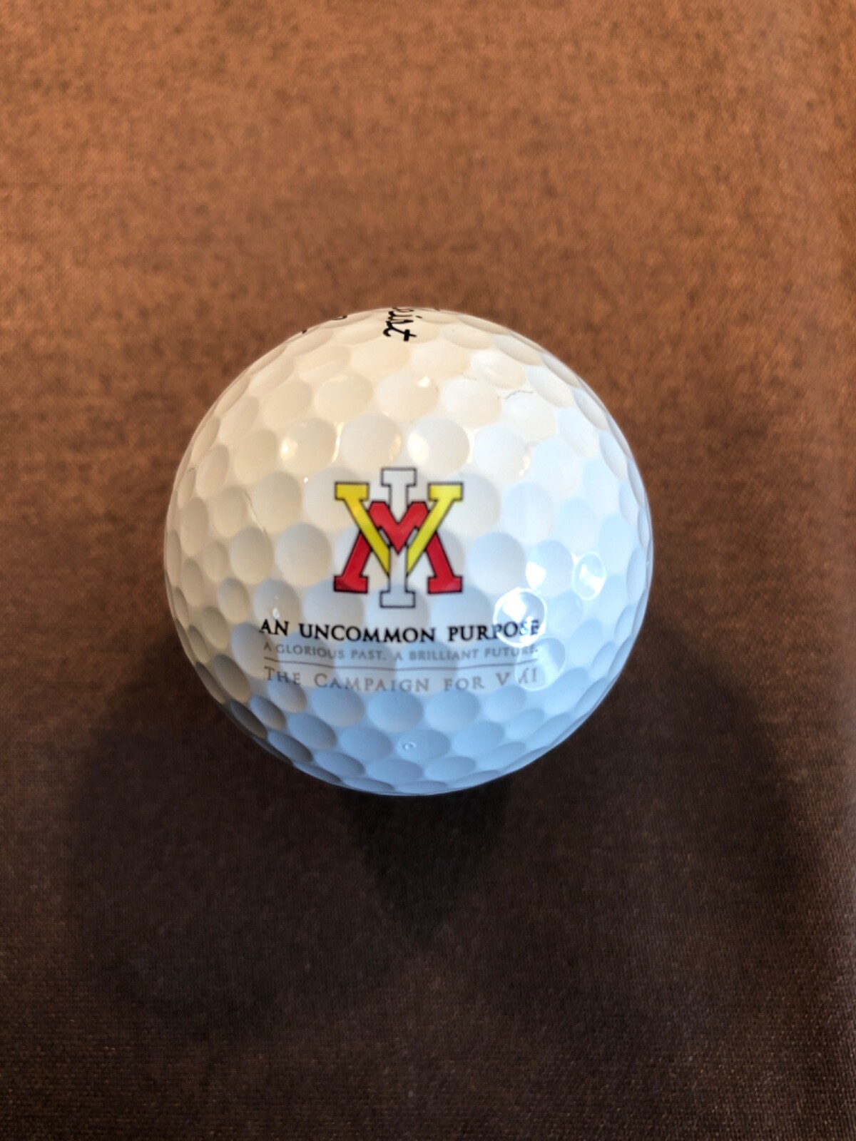 LOGO GOLF BALL-NCAA..VIRGINIA MILITARY INSTITUTE..AN UNCOMMON PURPOSE..PROV BALL