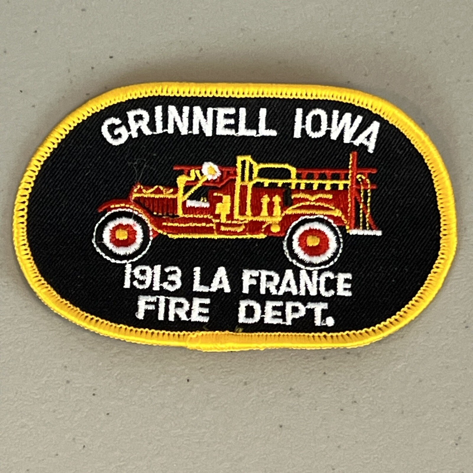 Grinnell Iowa Fire Department Patch featuring 1913 La France Fire Truck