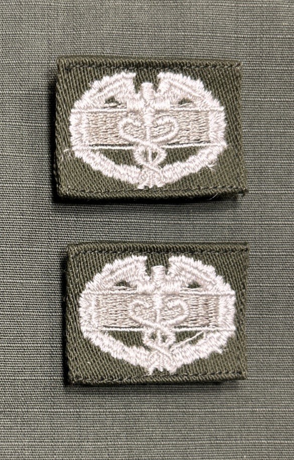 US Army CMB’s (2) White Sew-On Combat Medical Badge OD Green Utility Shirt