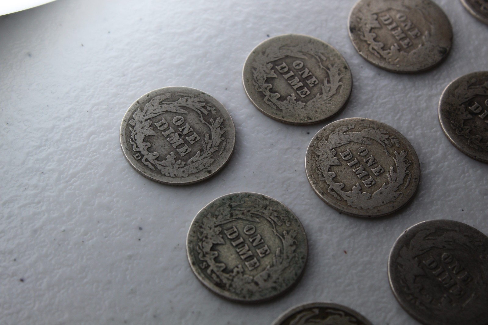 12 Very Old Very Worn Barber Dimes with dates