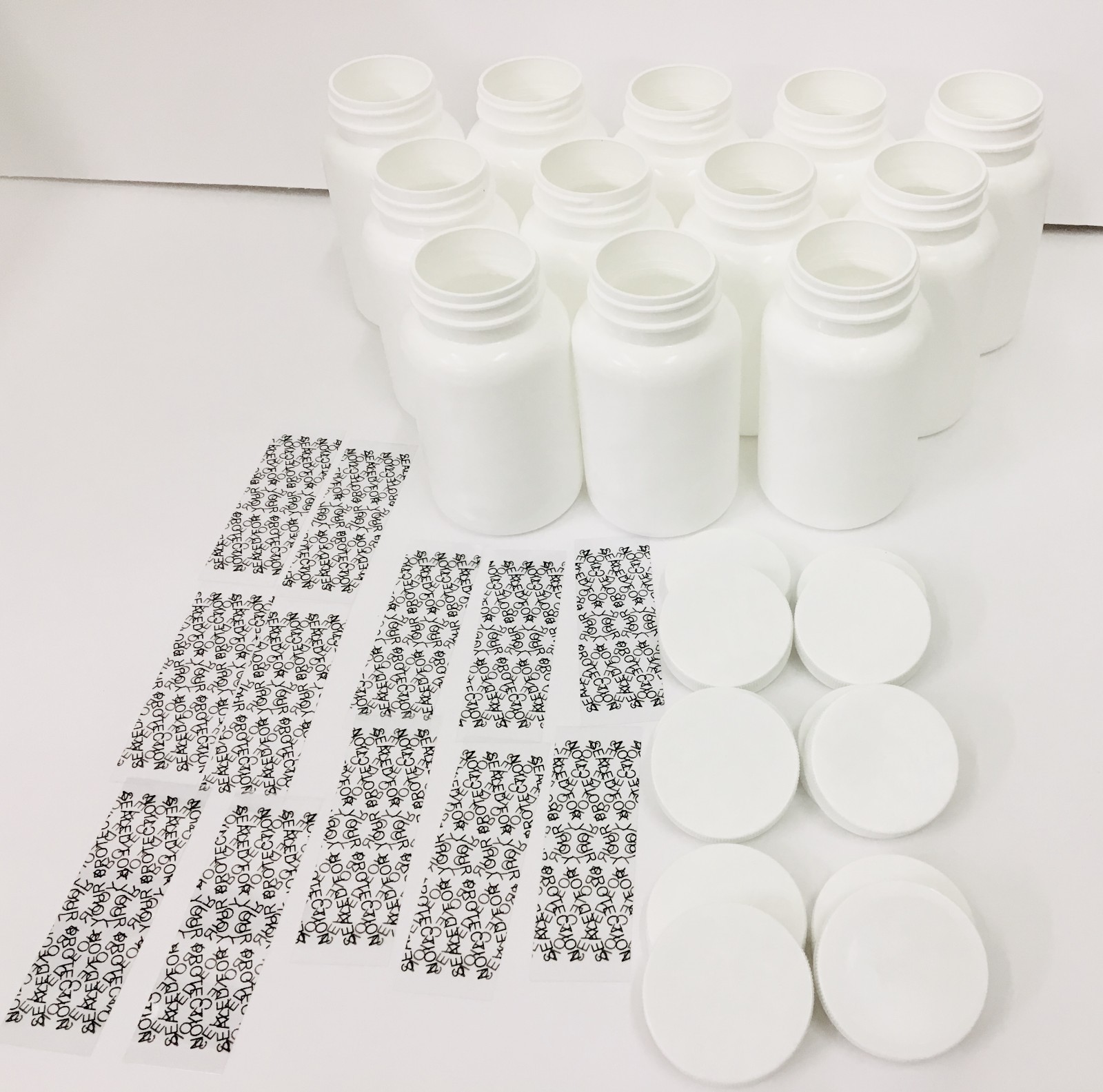 Plastic Bottles Set of 12 HDPE 300cc pill packer bottle. With caps and seals.