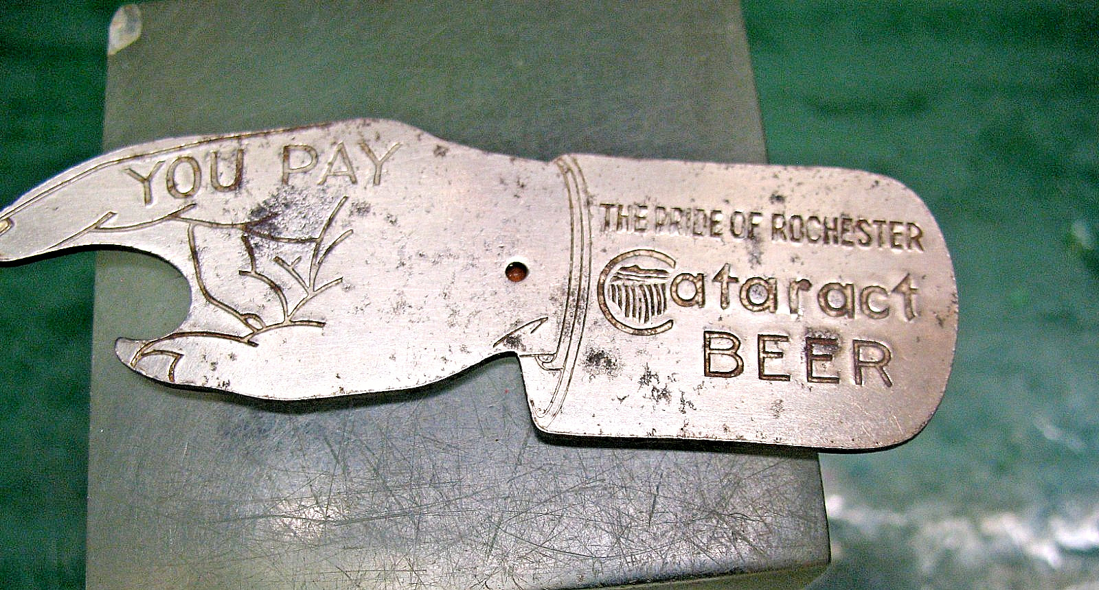CATARACT BEER THE PRIDE OF  ROCHESTER SPIN TO SEE WHO  PAYS BEER BOTTLE OPENER