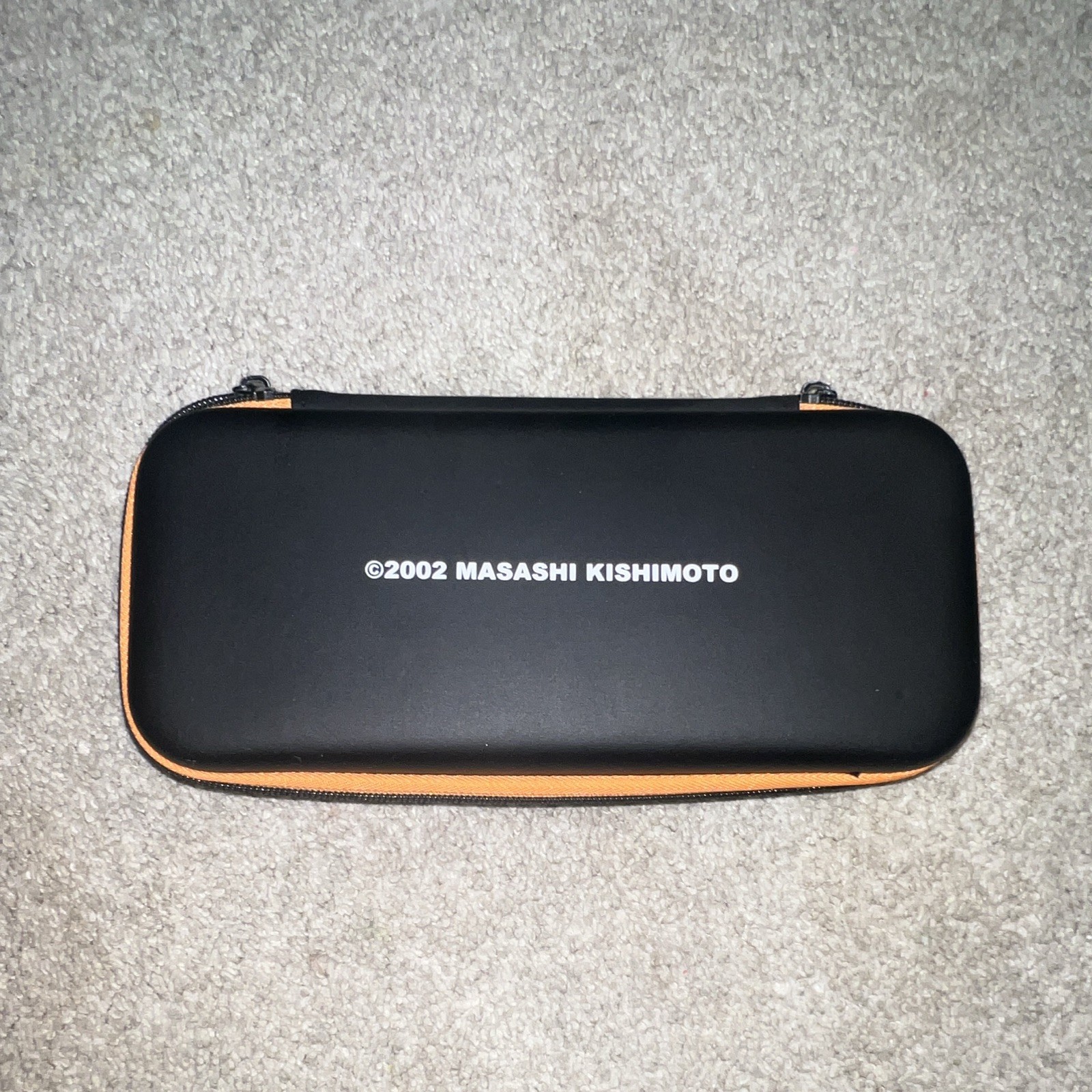 Masashi Kishimoto Naruto Switch Hard Shell Zipper Case Black/Orange