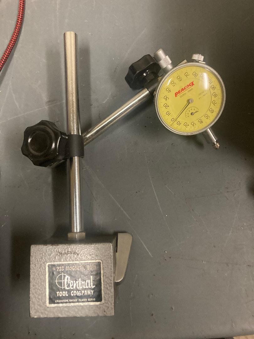 magnetic base with a No. PEACOCK  dial indicator 0001 lmm rev counter