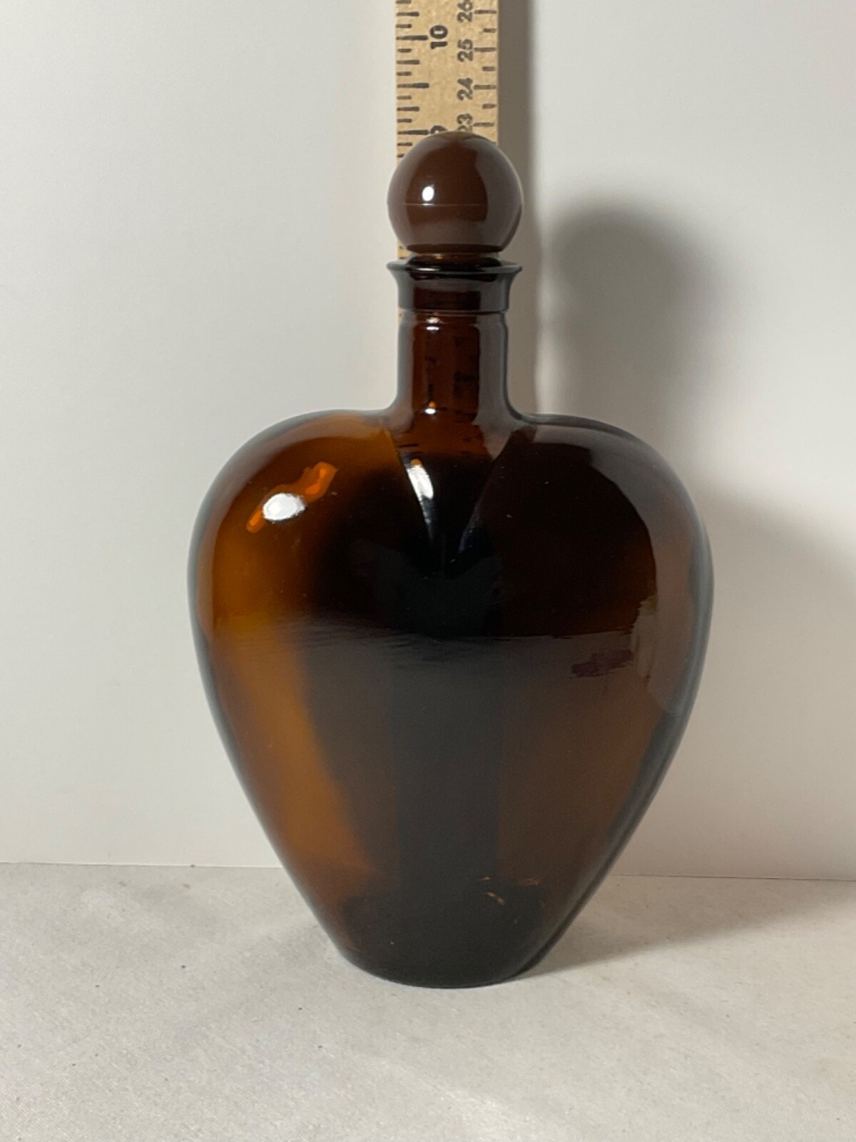Brown glass heart shaped bottle plastic cap 9”