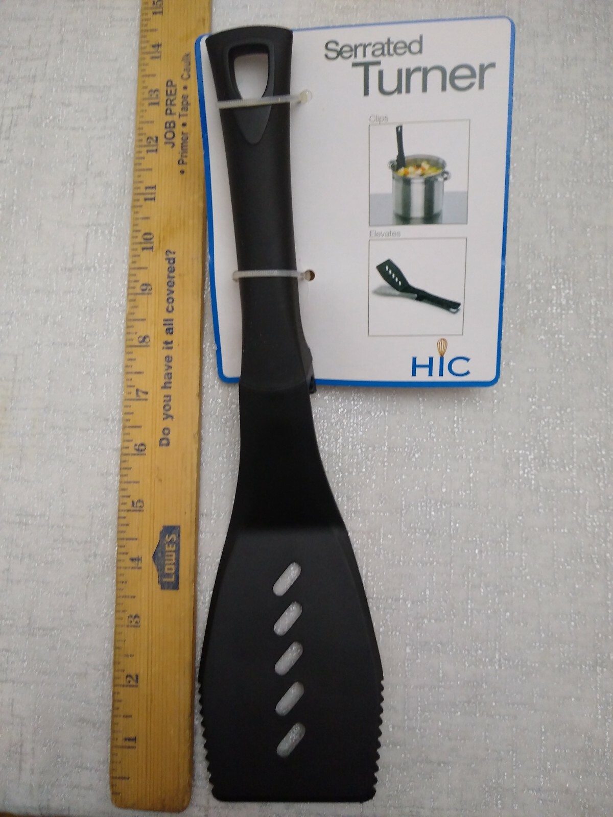 Hic serrated turner , black plastic ,pot hook