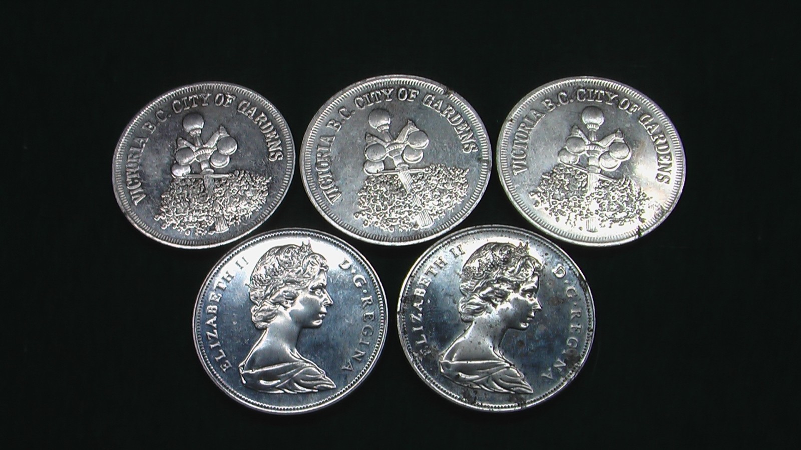 5 coins 2 canada dollars 3 Victoria  trade dollars city of gardens