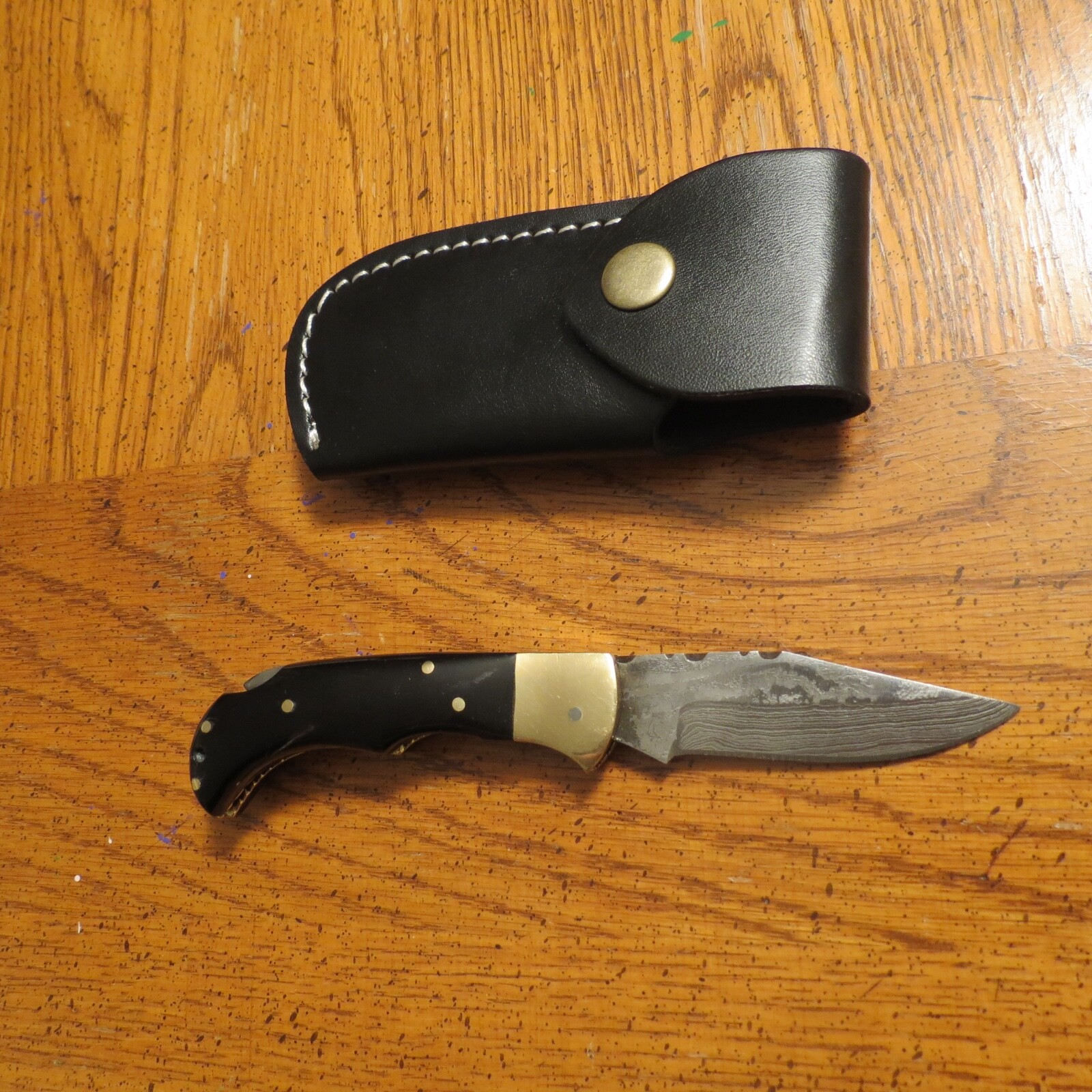 Damascus folding blade knife w/ black bone handle & leather sheath hand made