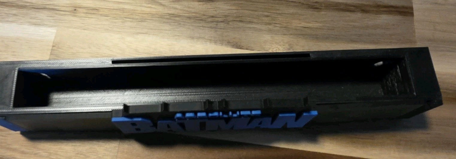Absolute Batman comic book stand For Raw Comics