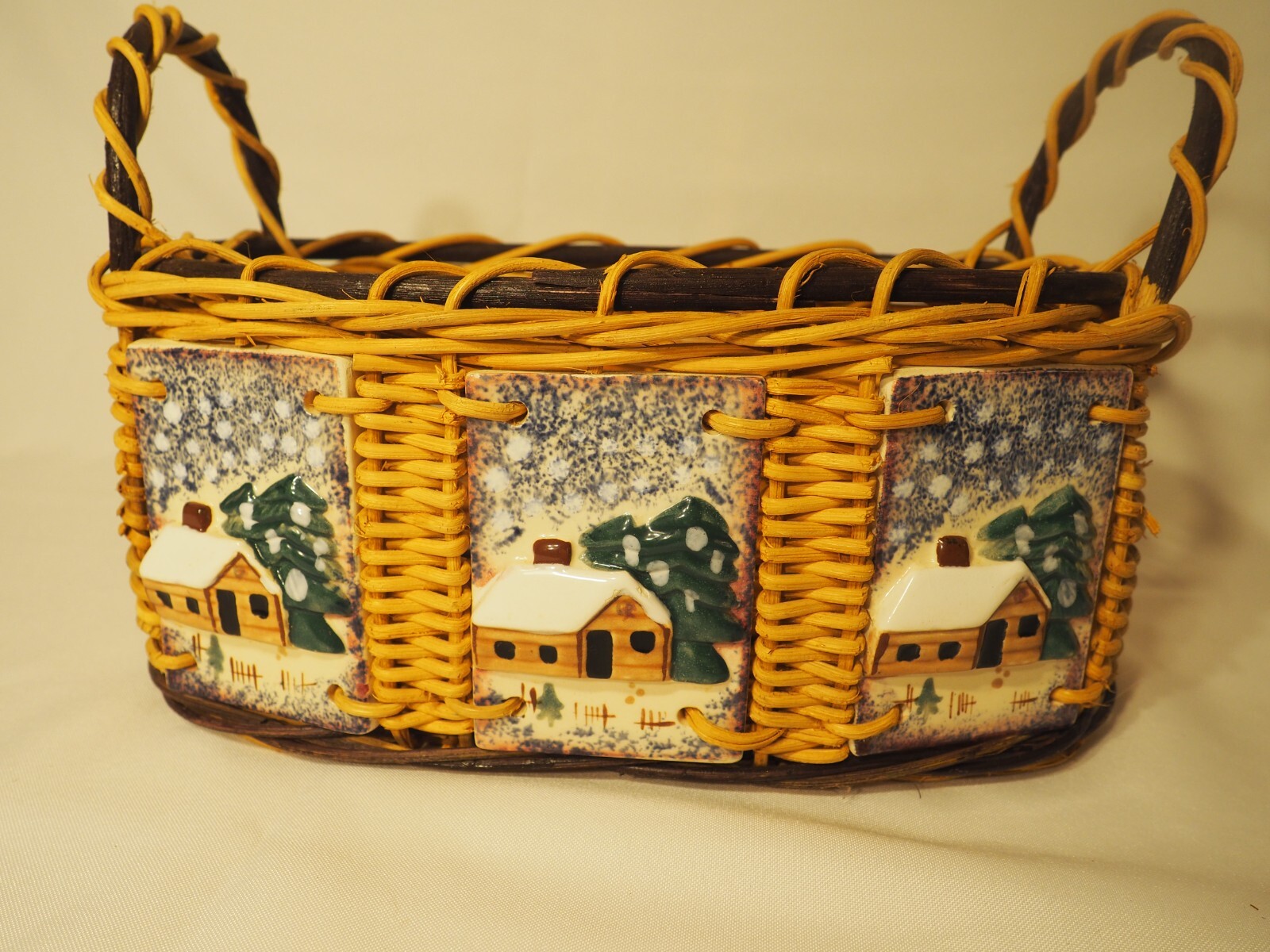Wicker Basket with Ceramic inlaid Cabin in Winter Oval 2 Handles